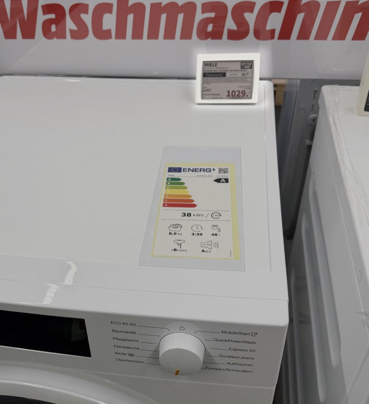 Electronic shelf label on a washing machine in an appliance store